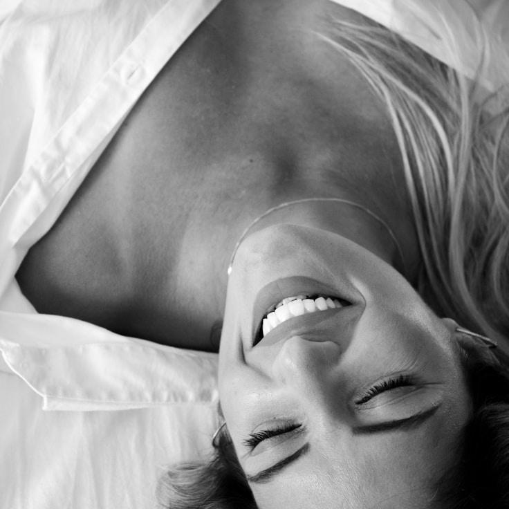 Kaveri Mehta, Lead Design Curator at Orchard Plain Loom, reviewing corporate floral arrangements